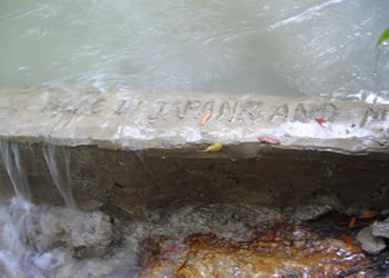 Youth members wrote down 'MADE IN JAPAN' on the dam